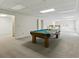 Spacious finished basement with a pool table and neutral carpet at 700 Henley Fields Cir, Johns Creek, GA 30097