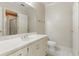 Bathroom with white vanity and white and cream wallpaper at 700 Henley Fields Cir, Johns Creek, GA 30097