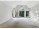 Spacious, sun-lit bedroom with large windows and vaulted ceilings at 700 Henley Fields Cir, Johns Creek, GA 30097