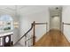 Grand foyer with hardwood floors, chandelier, and staircase at 700 Henley Fields Cir, Johns Creek, GA 30097
