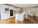 Bright kitchen with white cabinetry, stainless steel appliances, and a large center island at 700 Henley Fields Cir, Johns Creek, GA 30097