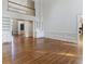 Open-concept living area with hardwood floors, built-in cabinets, and ample natural light at 700 Henley Fields Cir, Johns Creek, GA 30097