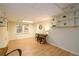 Basement featuring wood-look floors, tables, and natural light at 1885 Oak Wind Ln, Buford, GA 30519
