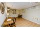 Basement featuring wood-look floors, tables, and shelving at 1885 Oak Wind Ln, Buford, GA 30519