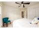 Bright bedroom featuring a ceiling fan, neutral decor, and plush carpet at 1885 Oak Wind Ln, Buford, GA 30519