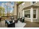 Exterior view of the home's deck with outdoor seating furniture at 1885 Oak Wind Ln, Buford, GA 30519