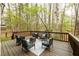 View of the deck with backyard featuring plentiful trees at 1885 Oak Wind Ln, Buford, GA 30519