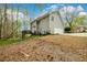 Exterior view of the home and back yard with a fenced perimeter at 1885 Oak Wind Ln, Buford, GA 30519