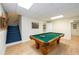 Game room featuring pool table, wood-look floors, and staircase at 1885 Oak Wind Ln, Buford, GA 30519