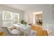 Bright home office with a large window, white desk, and views of other rooms at 1885 Oak Wind Ln, Buford, GA 30519