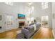 Spacious living room with high ceilings, a fireplace, and lots of natural light at 1885 Oak Wind Ln, Buford, GA 30519