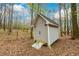 A storage shed with a ramp is located in the backyard at 1885 Oak Wind Ln, Buford, GA 30519