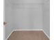Walk-in closet with neutral carpeting and white wire shelving for optimal storage and organization at 2191 Rockbridge Rd # 501, Stone Mountain, GA 30087