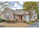 Attractive home features stone accents, a well-manicured lawn, and mature trees at 2191 Rockbridge Rd # 501, Stone Mountain, GA 30087