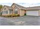 Tan home features an attached garage and stone accents on the facade at 2191 Rockbridge Rd # 501, Stone Mountain, GA 30087