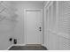 Bright laundry area with shelving for storage and easy access to outdoor exit at 2191 Rockbridge Rd # 501, Stone Mountain, GA 30087