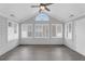 Light and airy sunroom with a vaulted ceiling, modern fan, and exterior access at 2191 Rockbridge Rd # 501, Stone Mountain, GA 30087