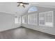 Bright sunroom with an arched window, neutral walls, and modern ceiling fan at 2191 Rockbridge Rd # 501, Stone Mountain, GA 30087