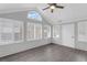 Relaxing sunroom featuring wood-look flooring, ceiling fan, and ample natural light at 2191 Rockbridge Rd # 501, Stone Mountain, GA 30087
