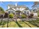 A spacious backyard features a multi-level deck with an upper-level dining area and mature landscaping at 2210 Holly Springs Rd, Rockmart, GA 30153