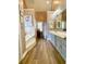 Primary bathroom features a soaking tub, separate vanities, and wood look plank flooring at 2210 Holly Springs Rd, Rockmart, GA 30153