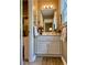 Bright bathroom features a vanity with white cabinets and modern fixtures at 2210 Holly Springs Rd, Rockmart, GA 30153
