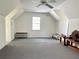 Spacious bonus room with carpet flooring, a ceiling fan, and a window providing natural light at 2210 Holly Springs Rd, Rockmart, GA 30153