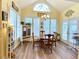 Dining area with large windows and a round table with chairs at 2210 Holly Springs Rd, Rockmart, GA 30153