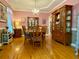 Formal dining room featuring a chandelier, hardwood floors, and elegant furniture at 2210 Holly Springs Rd, Rockmart, GA 30153