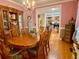 Formal dining room with hardwood floors, chandelier, and adjacent views of the office and living areas at 2210 Holly Springs Rd, Rockmart, GA 30153