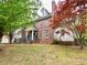 Beautiful brick home with a well-manicured lawn and mature trees at 2210 Holly Springs Rd, Rockmart, GA 30153