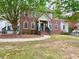 Charming two-story brick home with a covered front porch and landscaped yard at 2210 Holly Springs Rd, Rockmart, GA 30153