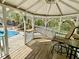 Poolside gazebo with seating providing shade and a relaxing outdoor living space at 2210 Holly Springs Rd, Rockmart, GA 30153