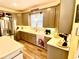 Bright, modern kitchen features stainless steel appliances, grey cabinets, an island, and wood-look flooring at 2210 Holly Springs Rd, Rockmart, GA 30153