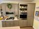 A kitchen featuring stainless steel appliances and gray cabinets at 2210 Holly Springs Rd, Rockmart, GA 30153