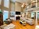 Spacious living room features hardwood floors, a fireplace, built-in shelving, and lots of natural light at 2210 Holly Springs Rd, Rockmart, GA 30153