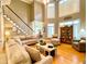 Comfortable living room with staircase, hardwood floors, lots of natural light, and neutral paint at 2210 Holly Springs Rd, Rockmart, GA 30153