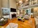 Bright living room features hardwood floors, a fireplace, built-in shelving, and lots of natural light at 2210 Holly Springs Rd, Rockmart, GA 30153