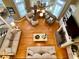 Overhead view of a living room that features hardwood floors, a fireplace, built-in shelving, and lots of natural light at 2210 Holly Springs Rd, Rockmart, GA 30153