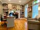 Charming office with built-in bookshelves, a fireplace, and a comfortable seating area at 2210 Holly Springs Rd, Rockmart, GA 30153
