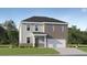Charming two-story home featuring a combination of siding and brick, complemented by a well-manicured lawn at 232 Paisley Way, Locust Grove, GA 30248