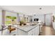 Open-concept kitchen with a kitchen island that flows into the living area, ideal for entertaining at 232 Paisley Way, Locust Grove, GA 30248