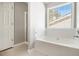 Bathroom features a soaking tub, shower, and decorative floor tiling at 3651 Sapphire Ct, Decatur, GA 30034