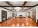 Finished basement with hardwood floors, coffered ceilings, and a modern fireplace at 4002 Moheb Sw St, Atlanta, GA 30331