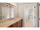 Bathroom with a white tiled floor, vanity, and a view into a connecting room at 4002 Moheb Sw St, Atlanta, GA 30331