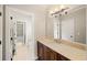 Bathroom with a white tiled floor, vanity, and a view into a connecting room at 4002 Moheb Sw St, Atlanta, GA 30331