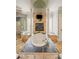 Elegant bathroom with a soaking tub, fireplace, and mounted television for luxurious relaxation at 4002 Moheb Sw St, Atlanta, GA 30331