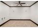 Spacious bedroom featuring plush carpet, dark trim and a modern ceiling fan at 4002 Moheb Sw St, Atlanta, GA 30331