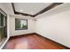 Bedroom featuring hardwood floors, dark trim and two large windows at 4002 Moheb Sw St, Atlanta, GA 30331