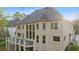 A large brick home with rear balcony and a manicured lawn at 4002 Moheb Sw St, Atlanta, GA 30331